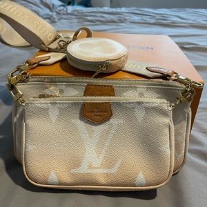Louis Vuitton multi pochette by the pool